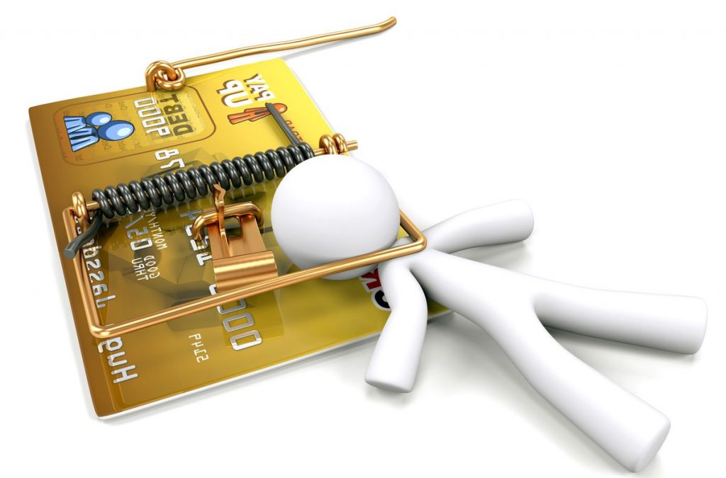 A man caught in a mouse trap made out of a credit card. Created to illustrate predatory lending and credit dangers.